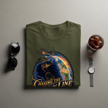 Load image into Gallery viewer, Green t-shirt with earth graphic and "Chasing The Day Line" text.
