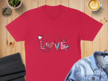 Load image into Gallery viewer, Red t-shirt with stethoscope, heart, syringe, and pills forming the word "love."
