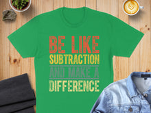 Load image into Gallery viewer, Green t-shirt with orange and yellow text "BE LIKE SUBTRACTION AND MAKE A DIFFERENCE".
