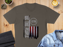 Load image into Gallery viewer, Brown t-shirt with "We the People" and American flag design.
