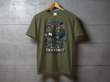 Load image into Gallery viewer, Olive green t-shirt with exploded view of radio and text "Built to Transmit".
