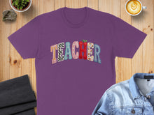 Load image into Gallery viewer, Purple t-shirt with "Teacher" in colorful, patterned letters.
