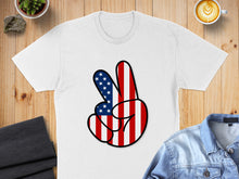 Load image into Gallery viewer, White t-shirt with a peace sign made of American flag stripes.
