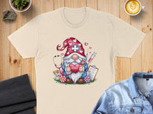 Load image into Gallery viewer, Nurse gnome holding heart, stethoscope, syringe, and pills on a t-shirt.
