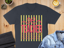 Load image into Gallery viewer, Dark grey t-shirt with "Teacher" text and colorful stripes.
