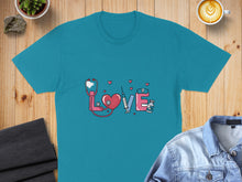Load image into Gallery viewer, Teal t-shirt with pink stethoscope, syringe, and hearts forming the word "love".
