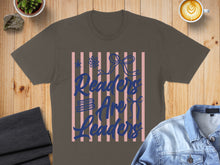 Load image into Gallery viewer, Brown t-shirt with "Readers Are Leaders" text and blue bows and stripes.
