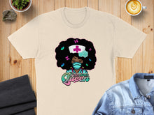 Load image into Gallery viewer, Cream t-shirt with cartoon nurse featuring afro and butterflies, reading "Trauma Queen".
