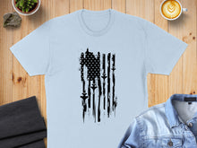 Load image into Gallery viewer, Light blue t-shirt with distressed American flag and fighter jets design.
