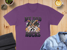 Load image into Gallery viewer, Purple t-shirt with "MY DAD ROCKS" and two crossed guitars graphic.
