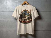 Load image into Gallery viewer, T-shirt with "GRID SQUARE HUNTER" graphic depicting a person with radio gear and map in nature.
