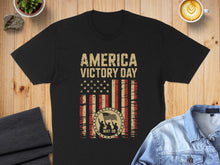 Load image into Gallery viewer, Black t-shirt with "America Victory Day May 08" and American flag design.

