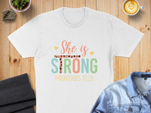 Load image into Gallery viewer, White t-shirt with "She is Strong" and Proverbs 31:25.
