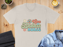 Load image into Gallery viewer, Retro graphic tee with "One Badass Nurse" text and floral accents.
