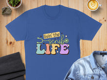 Load image into Gallery viewer, Blue t-shirt with "Livin' the Scrub Life" text and stethoscope graphic.

