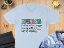 Load image into Gallery viewer, Light blue t-shirt with "Nurse" in colorful letters and stethoscope graphic.

