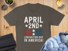 Load image into Gallery viewer, T-shirt with "April 2nd Liberation in America!" text and US flag design.
