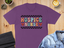 Load image into Gallery viewer, Purple t-shirt with "HOSPICE NURSE" text and heart-shaped electrocardiogram.

