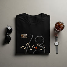 Load image into Gallery viewer, Black t-shirt with a cable forming the number 73 and a waveform design.
