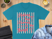 Load image into Gallery viewer, Teal t-shirt with "Helping Tiny Humans Do Big Things" text and pink ribbons.
