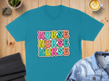 Load image into Gallery viewer, Turquoise t-shirt with "Nurse Nurse Nurse" in colorful, retro-style lettering.
