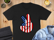Load image into Gallery viewer, Black t-shirt with American flag peace sign graphic.
