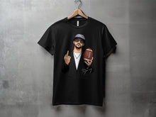 Load image into Gallery viewer, Graphic black t-shirt with cartoon man holding football

