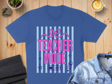 Load image into Gallery viewer, Blue t-shirt with "Teacher Mode On/Off" text and pink ribbon graphic.
