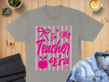 Load image into Gallery viewer, Grey t-shirt with pink text "In My Teacher Era" on a striped background.
