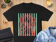Load image into Gallery viewer, Black t-shirt with "HELPING LITTLE MINDS GROW" in coral distressed lettering.

