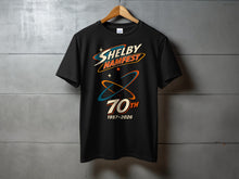 Load image into Gallery viewer, Black t-shirt with "Shelby Hamfest 70th 1957-2026" graphic.
