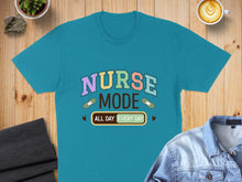 Load image into Gallery viewer, Teal t-shirt with "Nurse Mode All Day Every Day" text and band-aid graphics.
