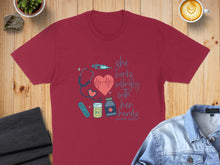 Load image into Gallery viewer, Maroon t-shirt with "She works willingly with her hands Proverbs 31:13" and medical icons.
