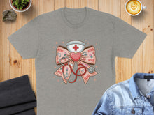 Load image into Gallery viewer, Gray t-shirt with a pink bow, stethoscope, and "XOXO" nursing graphic.
