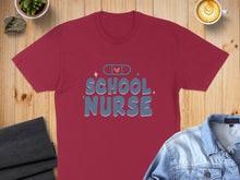 Load image into Gallery viewer, Burgundy t-shirt with "School Nurse" text and band-aid graphic.
