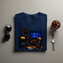 Load image into Gallery viewer, T-shirt featuring ham radio equipment, clock, microphone, and notebook with frequencies.
