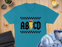 Load image into Gallery viewer, Teal t-shirt with "ABCD" text and a lightning bolt graphic.

