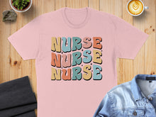 Load image into Gallery viewer, Pink t-shirt with retro "NURSE NURSE NURSE" text in pastel colors.
