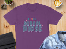 Load image into Gallery viewer, Purple t-shirt with "SCHOOL NURSE" text and a band-aid graphic.
