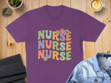 Load image into Gallery viewer, Purple t-shirt with "NURSE NURSE NURSE" in colorful retro lettering and flowers.
