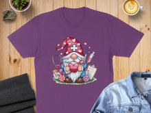 Load image into Gallery viewer, Purple t-shirt with nurse gnome graphic holding heart and stethoscope.
