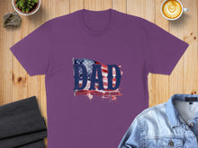 Load image into Gallery viewer, Purple t-shirt with "DAD" in distressed American flag font and splatter accents.
