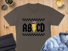 Load image into Gallery viewer, Dark grey t-shirt with "ABCD" and a lightning bolt graphic.
