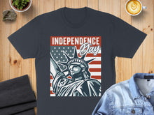 Load image into Gallery viewer, Dark t-shirt featuring Statue of Liberty and American flag graphic with "Independence Day" text.
