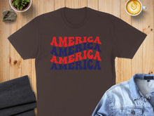 Load image into Gallery viewer, Brown t-shirt with "AMERICA AMERICA AMERICA" text in red and blue.
