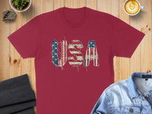 Load image into Gallery viewer, Burgundy t-shirt with distressed USA text and American flag design.
