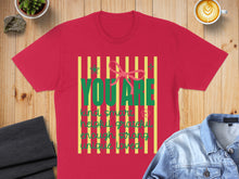 Load image into Gallery viewer, Red t-shirt with "YOU ARE" in large green letters and empowering words below.
