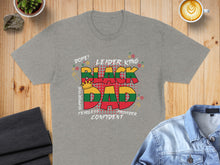 Load image into Gallery viewer, Grey t-shirt with "Black Dad" design in red, yellow, and green, surrounded by words.
