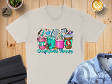 Load image into Gallery viewer, Occupational therapy coffee cups with icons on a cream t-shirt.
