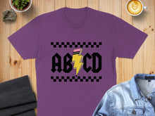 Load image into Gallery viewer, Purple t-shirt with AC/DC inspired lightning bolt graphic.
